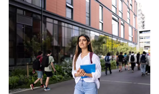 Student walking through campus