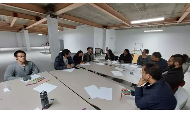 People sitting around a desk